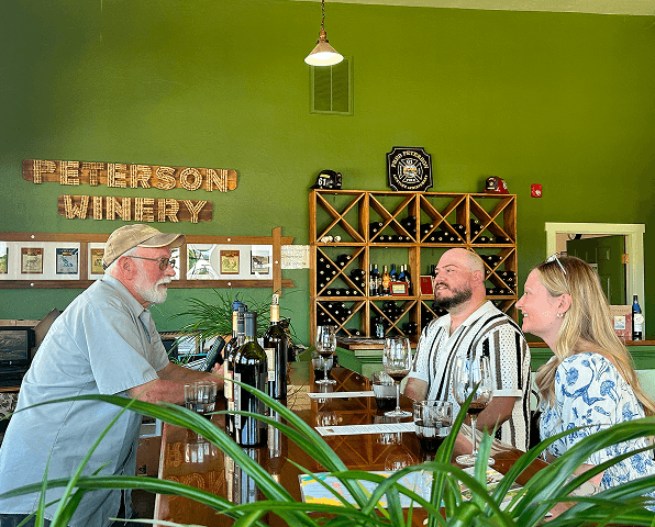 Guests enjoying a wine tasting inside Peterson Winery tasting room